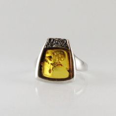 "Unisex light cognac Amber ring irregular shape for him or for her 925 sterling silver baltic amber in 925e solid silver  Dimensions Amber cab : 11.7 x 11.2 mm Length : 16.3 mm (0.64\") Width : 19 mm  (0.74\") Height : 23.5 mm (0.92\") Weight : 4.3 gr Ring size : 7 1/2 US CAD" Modern Baltic Amber Jewelry For Formal Occasions, Modern Amber Rings For Anniversary, Classic Formal Jewelry With Baltic Amber, Luxury Baltic Amber Jewelry With Polished Finish For Anniversary, Baltic Amber Ring For Anniversary, Baltic Amber Jewelry With Polished Finish For Anniversary, Elegant Baltic Amber Rings As Gift, Classic Formal Jewelry In Baltic Amber, Elegant Baltic Amber Rings For Gifts