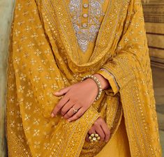 Mustard Designer Embroidered Silk Wedding Sharara Suit-Saira's Boutique Yellow Unstitched Suit With Intricate Embroidery For Wedding, Resham Embroidered Churidar For Wedding, Yellow Salwar Kameez With Intricate Embroidery For Weddings, Yellow Kurta With Intricate Embroidery For Wedding, Yellow Unstitched Suit For Wedding And Eid, Yellow Wedding Kurta With Intricate Embroidery, Wedding Yellow Kurta With Intricate Embroidery, Yellow Churidar With Chikankari Embroidery For Wedding, Yellow Chikankari Embroidered Churidar For Wedding