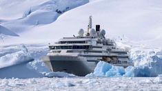 a cruise ship in the middle of an iceberg