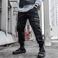 A stylish clothing that is hip hop and punk. It is fashionable, stylish, and it will look great on anyone who wears it. Do you wanahavit? Cargo Techwear, Cyberpunk Gang, Techwear Cargo Pants, Unique Clothing Stores, Cyberpunk Pants, Techwear Pants, Gothic Pants, Tactical Cargo Pants, Techwear Fashion