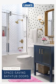 a bathroom with polka dot wallpaper and gold accents