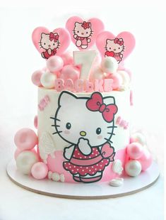 a hello kitty birthday cake with pink decorations