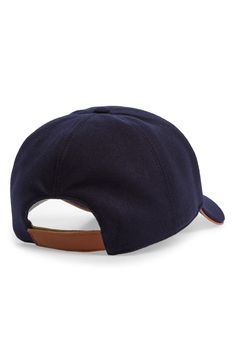 Elevate your casual look with this Italian-crafted baseball cap made of boiled wool and finished with an adjustable back strap in rich leather. Adjustable back strap 100% wool Dry clean Made in Italy Wool Adjustable Baseball Cap For Outdoor, Adjustable Wool Baseball Cap For Outdoor, Casual Wool Baseball Cap For Outdoor, Classic Adjustable Wool Baseball Cap, Brown Wool Visor Hat, Casual Leather Baseball Cap With Leather Patch, Navy Wool Casual Hat, Casual Leather Baseball Cap With Curved Brim, Adjustable Wool Six-panel Baseball Cap