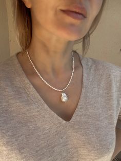 This baroque pearl pendant necklace is made of real fresh water pearls, including mini rice pearls that measure only around 2 mm. Both pearls are top AAA quality, with amazing lustre and color. This baroque pearl necklace is very versatile and elegant, you can easily add it to almost any outfit. Necklace length is 43 cm (17 inches). Customisation of length is possible, please contact me if you need it. Please note, that due to the natural origin of this product the shape of pearls might vary. If Delicate Pearl Necklace With Pearl Pendant, Delicate Pearl Necklace With Pendant, Pearl Necklace With Oval Pendant And Pearl Drop, Teardrop Pearl Charm Necklace, Baroque Pearl Chain Necklace In Pearl White, Pearl White Necklace With Briolette Pearl Charm, Teardrop Pearl Necklace With Pearl Charm, Pearl White Baroque Pearl Necklace With Pearl Chain, Teardrop Pearl Necklace With Pearl Chain