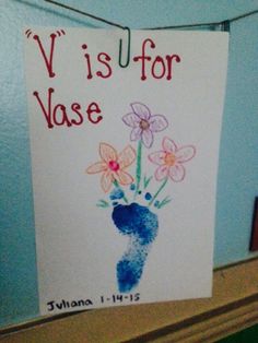 a sign that says vis is for vase with flowers painted on the front and bottom