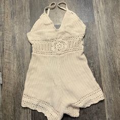 Beige Crochet Romper Beige Summer Crochet Knit Top, Beige Crochet Knit Summer Top, Beige Knit Crochet Top For Summer, Beige Knit Crochet Summer Top, Fitted Beige Crochet Top For Summer, Chic Fitted Crochet Top For Beach Season, Fitted Cream Crochet Top For Summer, Summer Cream Crochet Knit Top, Knitted Lace Crochet Top For Summer