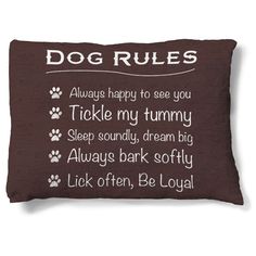 a dog pillow with the words dogs on it