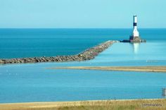 a light house sitting on top of a large body of water