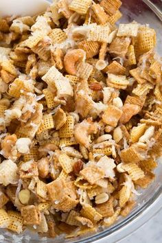 a glass bowl filled with cereal sitting on top of a table