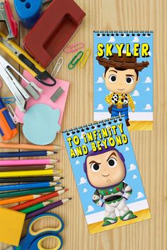 two personalized bookmarks on a table with pens, scissors and other school supplies