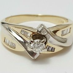 a gold ring with a diamond in the center