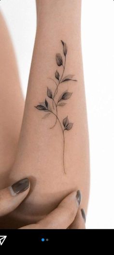 a woman's foot with a flower tattoo on it