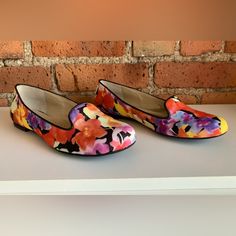 Step Into Style With These Beautiful Adrienne Vittadini Ballet Flats. Featuring A Stunning Floral Pattern, These Slip-On Shoes Are Perfect For Any Casual Occasion. The Upper Material Is Made From Comfortable Fabric And Comes In A Vibrant Multicolor Design Of Pink, Purple, Yellow, And Red. These Flats Are A Size 6 And Are Brand New Without A Box. They Are Perfect For Any Women's Shoe Collection And Are Sure To Impress. Don't Miss Out On This Opportunity To Add A Gorgeous Pair Of Flats To Your War Orange Slip-on Flats For Spring, Fitted Slip-on Flats For Summer, Multicolor Slip-on Flats For Spring, Multicolor Round Toe Flats For Spring, Yellow Slip-on Flats For Spring, Multicolor Slip-on Summer Flats, Multicolor Slip-on Flats For Summer, Multicolor Closed Toe Flats For Spring, Yellow Flats With Removable Insole