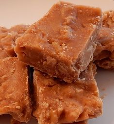 three pieces of peanut butter fudge on a white plate