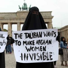 two women in burkas holding signs that read the muslim wants to make afghan women invisible