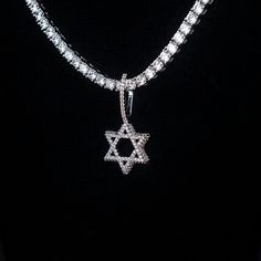 Introducing the Micro Diamond Pave Star of David Pendant- a symbol of protection, unity, and connection. Crafted with detail and care, this pendant shines with hand-set baguette stones, honoring the Jewish religion. Whether worn as a statement piece or as a daily reminder of faith and tradition, this pendant seamlessly blends style with spirituality. Pair it with a Diamond Tennis Chain for a set that will shine! This product is guaranteed for life - GLD will repair the item should you experience Diamond White Star Of David Jewelry Gift, Diamond White Cubic Zirconia Star Jewelry, Luxury White Gold Star Of David Jewelry, Silver Diamond Jewelry With Star Charm, Diamond White Star-shaped Cubic Zirconia Jewelry, Luxury Silver Star Of David Jewelry, Silver Cubic Zirconia Star Of David Jewelry, White Gold Star Of David Jewelry Gift, White Gold Star Of David Jewelry For Gift