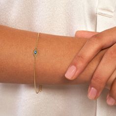 Real 14K Gold Mini Evil Eye Adjustable Bracelet for Women | Yellow Gold, 7.5 Inches (6.5+1) | 0.80mm Chain Thickness Protect yourself with style using our elegant 14K Gold Mini Evil Eye Adjustable Bracelet for Women. Crafted in luxurious yellow gold, this dainty bracelet features a mini evil eye charm believed to ward off negative energy and bring good luck. The adjustable design ensures a perfect fit, with a length of 7.5 inches and a chain thickness of 0.80mm. Finished with a secure lobster closure, this bracelet is both fashionable and functional, making it a must-have accessory for any modern woman. * Stylish 14K yellow gold bracelet with a mini evil eye charm * Length: 7.5 inches (6.5+1) ; Chain thickness: 0.80mm * Adjustable design for a customizable fit * Features a secure lobster c Yellow Gold May Birthstone Bracelets For Anniversary, Yellow Gold Bracelets For Anniversary, May Birthstone, 14k Gold Birthstone Bracelet For Anniversary, 14k Gold Bracelet With Birthstone For Formal Occasions, Gold Diamond Bracelet With Birthstone In 14k Gold, Formal 14k Gold Bracelet With Birthstone, 14k Yellow Gold Bracelets For Birthday Gift, Yellow Gold 14k Bracelets For Birthday Gift, Gold Diamond Bracelet For May Birthstone