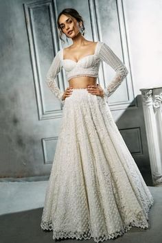 Ivory attached can-can lehenga with sequins, cutdana, crystals and pearl embroidery. Paired with embroidered blouse and dupatta. - Aza Fashions Fitted Lace Choli For Reception, Fitted Cream Lace Sets, Cream Lace Fitted Sets, White Fitted Sharara With Lace Work, Fitted Bollywood Style White Wedding Dress, Fitted Lace Sets For Reception, Fitted Lace Anarkali Set For Reception, Fitted Lace Choli With Sheer Dupatta, Fitted Anarkali Lace Lehenga