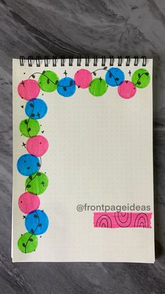 an open spiral notebook with buttons on it