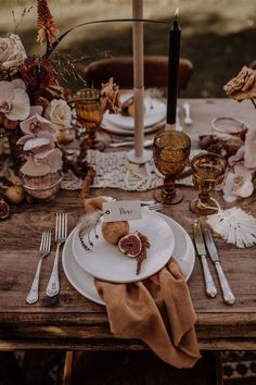 a white plate topped with food on top of a wooden table next to silverware