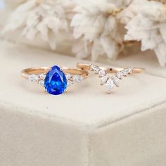 two different types of engagement rings with blue and white stones on top of each other