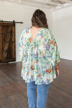 Flaunt a dashingly divine look in the Fabled in Floral Draped Peplum Top. This sultry chiffon top flaunts an inviting peplum hem, dandy dolman sleeves, and a beguiling v-neckline—sure to inspire envy. Add a sleek air of floral elegance to any ensemble with this gorgeous top! Poly Chiffon V-Neckline Elasticated Waistband Peplum Sheer Gathered Sleeve Detail 100% Polyester True to Size S: Chest 40" Length 27"M: Chest 42" Length 27"L: Chest 45" Length 27"XL: Chest 48" Length 28"1XL: Chest 50" Length Floral Chiffon Top, Draped Blouse, Distressed Boyfriend Jeans, Judy Blue Jeans, Peplum Hem, Floral Chiffon, Bottom Clothes, Sleeve Detail, Chiffon Top