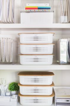 white storage containers stacked on top of each other