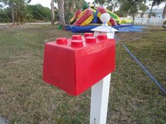 an inflatable water balloon is tied to a post