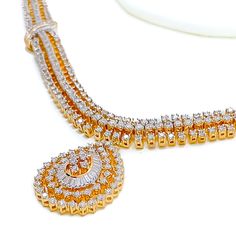 This exquisite 18k gold set, weighing 48.3 grams, features an opulent leaf-adorned design adorned with dazzling diamonds. The yellow gold finish enhances its luxurious appeal, making it perfect for any special occasion. The set includes a necklace with a total diamond weight of 7.47 carats, featuring F-G color and VS quality diamonds in round and tapered baguette shapes. The necklace has a length of 16.5 inches with a 1-inch drop length, adjustable 1-inch links, and a secure hook lock. The match Lock Style, Gold Set, Quality Diamonds, Matching Earrings, Gold Finish, Diamond Shapes, Timeless Beauty, Colored Diamonds, 1 Inch