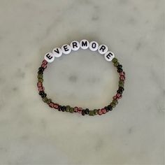 -bracelet inspired by taylor swifts album -stretchy bracelet August Bracelet Taylor Swift, Taylor Swift Clay Bead Bracelet Ideas, Taylor Swift Bracelets Ideas, Evermore Bracelet, Taylor Swift Bracelet Ideas, Friendship Bracelets Taylor Swift, Eras Bracelet, Swiftie Bracelets, Bracelet Taylor Swift