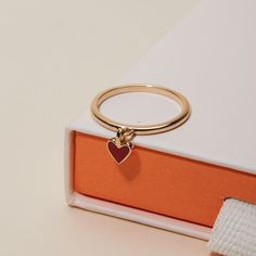 Hold a tiny treasure of love close to you with our adorable Valentines Ring. Perfect for matching moments between best friends or gifted as a sweet symbol of affection, each ring features a dainty red heart that moves delicately against the ring band.&nbsp;18K Champagne Gold PlatedHeart: 0.24Sent with love in a complimentary gift box Tiny Treasures, Valentine Heart, Champagne Gold, Ring Band, Engraved Rings, San Valentino, Red Heart, Gift Bag, Band Rings