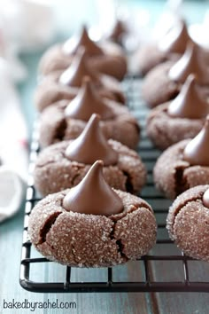 several cookies with chocolate frosting on a cooling rack