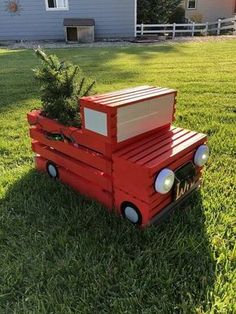 a red truck with a christmas tree on the back