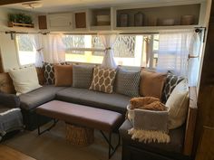 a couch and ottoman in a small living room