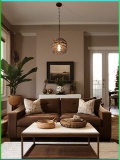 a living room filled with furniture and a large potted plant on top of a coffee table