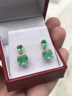 Colombian emerald dangling studs in fine 14K yellow gold. Displayed are medium-green teardrop and Asscher cut emeralds with very good transparency, accented by a simple prong gold mount, allowing for the emeralds to be shown in full view. The earth mined, green emeralds have a desirable lush green color with excellent qualities. These earrings are ideal for everyday use and are the perfect accessory to any outfit. Total Carat Weight: 3.40tcw Setting Style: Four Prong/ Double Prong Setting Materi Colombian Emerald Earrings, Classic Emerald Pear-shaped Earrings, Classic Pear-shaped Emerald Earrings, Formal Pear-shaped Emerald Earrings, Fine Jewelry Emerald Pear-shaped Earrings, Emerald Earrings With Prong Setting, Pear-shaped Emerald Earrings Fine Jewelry, Emerald Pear-shaped Fine Jewelry Earrings, Pear-shaped Emerald Green Earrings