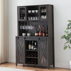 an entertainment center with wine glasses and bottles