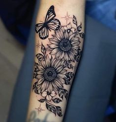 a sunflower and butterfly tattoo on the arm