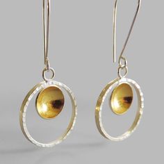 These elegant earrings will shine on your ears. Perfect as a gift or for yourself to add lots of sparkle to your style. Made of sterling silver and finished with 24k gold keum boo on the inside of the dome. Hammered sterling silver hoop. Measure: disc: 1/2″ or 11mm hoop: 1″ diameter. length: 2″ or 50mm Arrives to you in a gift box with foam padding and tissue paper. This item is a special made to order piece. Please allow me at least one week to complete your piece before it is shipped. If you n Gold Sterling Silver Circle Earrings, Gold Circle Earrings In Sterling Silver, Gold Open Circle Sterling Silver Earrings, Gold Sterling Silver Open Circle Earrings, Gold Sterling Silver Round Disc Earrings, Keum Boo, Hammered Sterling Silver, Shine On, Sterling Silver Hoops