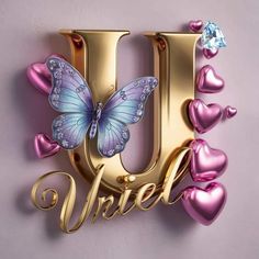 the letter u is decorated with hearts and a butterfly