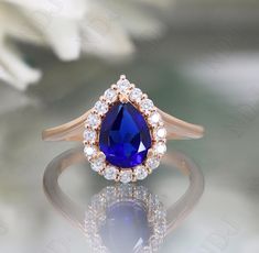 an oval shaped blue sapphire and diamond ring