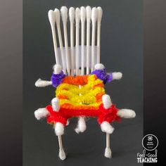 an odd chair made out of toothpicks and yarn is featured in this image