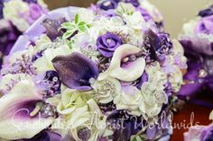 the bridal bouquet has purple and white flowers