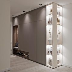 a room that has some shelves on the wall with shoes in it and lights above them