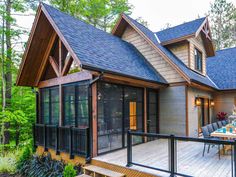 a house with a deck and stairs leading up to it