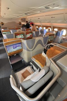 the inside of an airplane with lots of seats