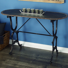 a table with three cups on it in front of a blue wall