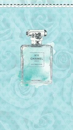 a bottle of chanel perfume sitting on top of a blue and white wallpaper