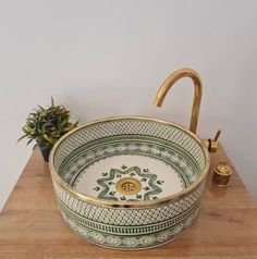 Introducing our Handcrafted Farmhouse Basin, a stunning blend of mid-century inspiration and artisanal craftsmanship designed to enhance the charm of your bathroom. With its unique brass rim and a beautiful green basin sink, this basin is a standout piece that adds elegance and character to any space. Each basin is meticulously handcrafted, showcasing the skill and attention to detail of our artisans. The brass rim exudes a timeless appeal, addin Clay Sinks, Mid Century Modern Vanity, Moroccan Sink, Eco Friendly Decor, Office Layout, Basin Sink, Modern Vanity, Fish Scales, Ceramic Sink