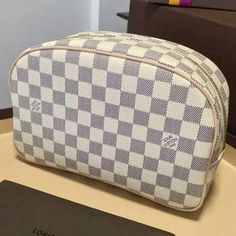 ® Description: Carrying beauty products and toiletries has never been so chic. The spacious Toiletry Kit in feminine Damier Azur canvas is adorned with glamorous golden finished hardware and soft leather trimmings. Size: 9.8 x 6.7 x 3.5 inches / 25cm x 17cm x 9cm (Length x Height x Width) Detailed Features: – Natural cowhide leather trimmings – Zipped, wide opening – 1 interior zipped pocket – Washable lining All photos are of actual item being sold. All items come with louis vuitton original pa Louis Vuitton Delightful, Louis Vuitton Designer, Toiletry Kit, Lv Handbags, Lv Bag, Louis Vuitton Speedy Bag, Louis Vuitton Handbags, Authentic Louis Vuitton, Toiletry Bag